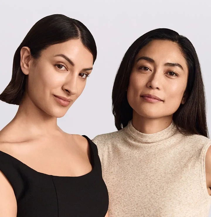 Two women photographed against Galderma's studio grey